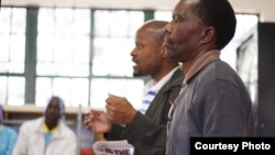 Fusi Mofokeng and Tshokolo Mokoena speak to South African students shortly after their release from prison for a crime they say they did not commit, January 2013. (Wits Justice Project) 