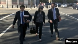 FILE - Kyle Freeny (C) and Andrew Weissmann (R), members of special counsel Robert Mueller's team of prosecutors probing potential ties between Russia and U.S. Presidential Donald Trump's 2016 campaign, leave court in Washington D.C., U.S., Sept. 29, 2017.