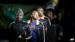 FILE - Nigerian returnees from Libya disembark from a plane upon arrival at the Murtala Muhammed International Airport in Lagos, Nigeria, Dec. 5, 2017. 