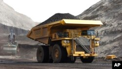 FILE - A mining truck hauls coal at Cloud Peak Energy's Spring Creek strip mine near Decker, Mont. The Northern Cheyenne Tribe challenged the Trump administration decision to life a moratorium on coal leases. The neighboring Crow tribe supports the decision. 