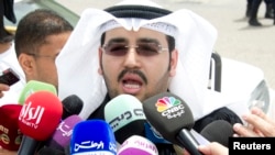 Laywer Ali al Ali speaks to the media in Kuwait City, June 16, 2013, after leaving the courthouse to announce the court's decision to dissolve parliament. 