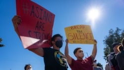 Protesters hold placards during the Asian Justice Rally. Some Asian organizations held a rally in five cities of the United States demanding justice for Asian-American crime victims. These five cities are Los Angeles, New York, San Francisco, Chicago and