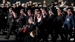 Veterans from the Oman Trucial Scouts process during the service of remembrance at the Cenotaph in Whitehall, London, Sunday, Nov. 10, 2013. 