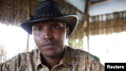 FILE - Indicted war criminal Bosco Ntaganda poses for a photograph during an interview with Reuters in Goma, Democratic Republic of Congo, October 5, 2010.