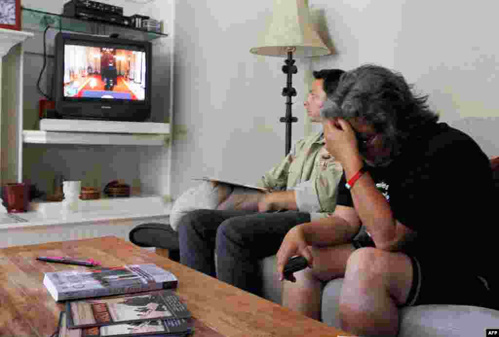 June 22: Rosanna Cambron (R), whose son Arturo is serving in the U.S. military in Iraq, cries as she watches President Obama speak. Obama announced a plan to start bringing U.S. troops home from Afghanistan in a significant first step toward ending the lo