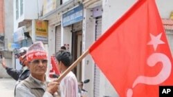 Maoist supporter en route for a mass rally in central Kathmandu, 1 May 2010