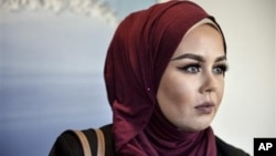 Norway fines hairdresser for refusing Muslim in hijab 