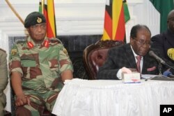 Zimbabwean President Robert Mugabe delivers his speech during a live broadcast at State House in Harare, Nov, 19, 2017.