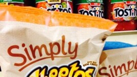 FILE - In this Jan. 24, 2014, file photo, Simply Cheetos are displayed in New York. Frito-Lay is opening a pop-up Cheetos-themed restaurant in New York City for three days beginning Tuesday, Aug. 15, 2017. (AP Photo/Candice Choi, File)
