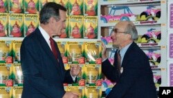 FILE - Toys R Us founder Charles Lazarus, right, speaks as President George H. Bush visits the toy chain's second store to open in Japan, Jan. 7, 1992. 