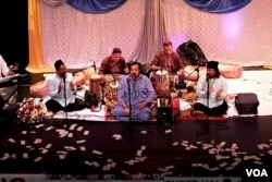 FILE - Amjad Sabri (C) performed at a Qawwali Concert in Annandale, Virginia, in 2013. Qawwali is a form of Sufi Devotional Music popular in South Asia, particularly in areas with a historically strong Muslim presence, such as Pakistan and parts of North India. (Saqib Ul Islam/VOA)