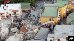 A collapsed building is seen in this aerial view of Casamicciola, on the island of Ischia, near Naples, Italy, a day after a 4.0-magnitude quake hit the Italian resort island, Aug. 22, 2017.