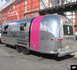 The traveling exhibition of humanitarian design solutions is pulled by a biodiesel-powered truck.