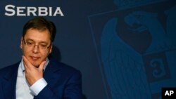 FILE - Serbian Prime Minister Aleksandar Vucic gestures, during a press conference, in Belgrade, Serbia, Oct. 30, 2016.