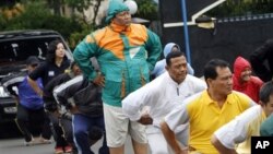 Indonesian police officers exercise during a new diet program.