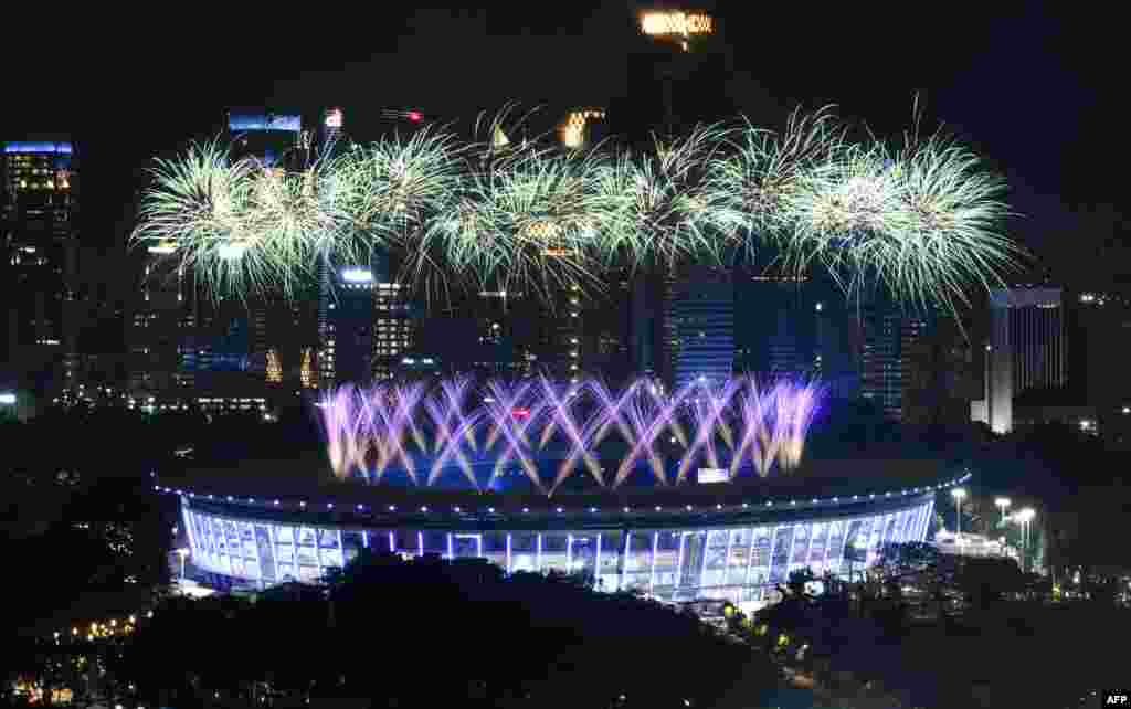 Fireworks explode over the Gelora Bung Karno main stadium during the opening ceremony of the 2018 Asian Games in Jakarta, Indonesia, Aug. 18, 2018.