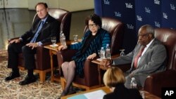 U.S. Supreme Court justices Samuel Alito, Jr., left, Sonia Sotomayor, second from left, and Clarence Thomas, second from right, listen to a question by law professor Kate Stith, right foreground, during a conversation at Yale University, in 2014. Thomas graduated from Yale Law School in 1974, Alito in 1975 and Sotomayor in 1979. The five other current Supreme Court justices all attended Harvard's law school, as did Donald Trump's nominee, Neil Gorsuch.(AP Photo/Jessica Hill)