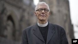 Rev. Gary Hall, dean of the Washington National Cathedral, stands outside the church in Washington, Wednesday, Jan. 9, 2013. 