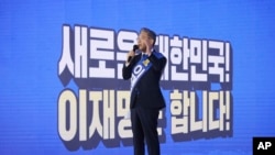 Gyeonggi Governor Lee Jae-myung, one of the ruling Democratic Party's contenders for next year's presidential election, speaks during the final campaign to choose the presidential election candidate in Seoul, South Korea, Oct. 10, 2021.