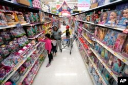 Shoppers look at toys at a Walmart Supercenter in Houston, Texas on Nov. 9, 2018.