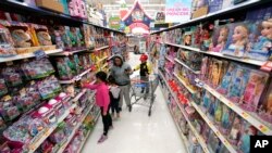 Shoppers look at toys at a Walmart Supercenter in Houston, Texas on Nov. 9, 2018.