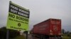 FILE - A sign for "No border" is seen on the border between Northern Ireland and Ireland in Jonesborough, Northern Ireland, Dec. 10, 2018.