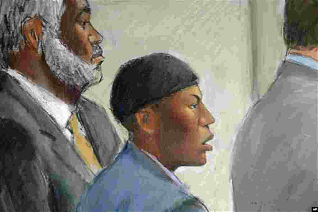 In this courtroom drawing, Umar Farouk Abdulmutallab (C) appears in U.S. District Judge Nancy Edmunds' courtroom in Detroit, Michigan, with Anthony Chambers, the lawyer who was assisting in his defense (L) and Assistant U.S. Attorney Jonathan Tukel (R), O