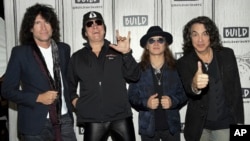 The rock band Kiss, from left, Tommy Thayer, Gene Simmons, Eric Singer and Paul Stanley pose backstage before the BUILD Speaker Series to discuss their "End Of The Road" farewell world tour at AOL Studios, Oct. 29, 2018, in New York. 