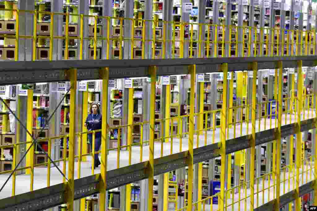 An employee works at the Amazon electronic commerce company's logistics center in San Fernando de Henares, near Madrid, on the eve of "Black Friday."