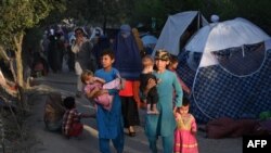Біженці в Кабулі, які втікають з районів Афганістану, де активізувалися бойові дії з Талібаном 11 серпня 2021 р.