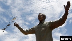 FILE - A bronze statue of late former South African President Nelson Mandela is seen in Pretoria, Dec. 16, 2013. A story in the British Sunday Times says the CIA helped South Africa’s apartheid government arrest Nelson Mandela in 1962.