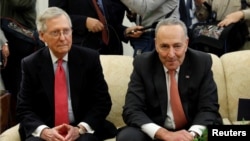 Senate Majority Leader Mitch McConnell and Senate Minority Leader Chuck Schumer take part in a meeting with U.S. President Donald Trump and other Congressional leaders in the Oval Office of the White House in Washington, Dec. 7, 2017. 