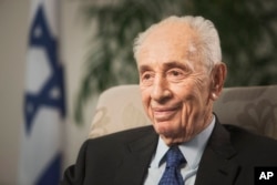 FILE - Former Israeli President Shimon Peres speaks during an interview with The Associated Press in Jerusalem, Nov. 2, 2015.