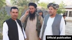 FILE - Mawlawi Habib Rahman, center, an Islamic State commander in northern Afghanistan, is seen in Jowzjan province.
