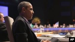 سه‌رۆک ئۆباما به‌شداری ده‌ستپێکی کۆبوونه‌وه‌ی لوتکه‌یی ناوکی له‌ 24ی مارسی 2014 له‌ لاهه‌ دا.