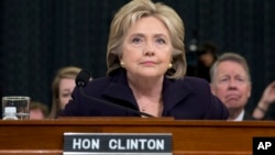 Democratic presidential candidate, former Secretary of State Hillary Rodham Clinton takes her seat on Capitol Hill in Washington, Oct. 22, 2015, prior to testifying before the House Benghazi Committee.