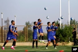 Iran's national men's football team takes part in a training session a day before their Group A match against Syria during the 2018 FIFA World Cup Russia Qualifier, in Tehran, Iran, Sept. 4, 2017.