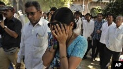 An unidentified relative of one of the convicted Hindus breaks down upon hearing the verdict at the district court in Mehsana, about 40 kilometers (25 miles) north of Ahmadabad, India, November 9, 2011.