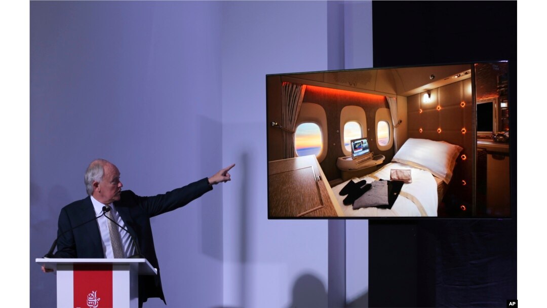 Emirates Airline President Tim Clark shows off new, state-of-the-art, first class private suites, during a press conference at the opening day of the Dubai Air Show, United Arab Emirates, Nov. 12, 2017.
