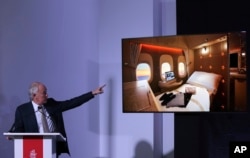 Emirates Airline President Tim Clark shows off new, state-of-the-art, first class private suites, during a press conference at the opening day of the Dubai Air Show, United Arab Emirates, Nov. 12, 2017.