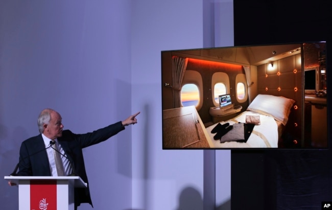 Emirates Airline President Tim Clark shows off new, state-of-the-art, first class private suites, during a press conference at the opening day of the Dubai Air Show, United Arab Emirates, Nov. 12, 2017.
