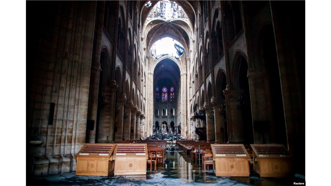 A view of the damaged roof and debris inside Notre-Dame de Paris in the aftermath of a fire that devastated the cathedral during the visit of French Interior Minister Christophe Castaner (not pictured) in Paris, France, April 16, 2019.