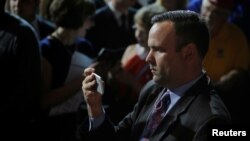 FILE - Dan Scavino, director of social media and senior adviser to then-Republican presidential candidate Donald Trump, records Trump greeting audience members at a campaign rally in Bangor, Maine, June 29, 2016.