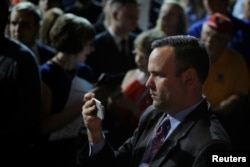 FILE - Dan Scavino, director of social media and senior adviser to then-Republican presidential candidate Donald Trump, records Trump greeting audience members at a campaign rally in Bangor, Maine, June 29, 2016.