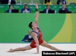 United States' Alexander Naddour performs on the floor during the artistic gymnastics men's team final at the 2016 Summer Olympics in Rio de Janeiro, Brazil, Monday, Aug. 8, 2016.