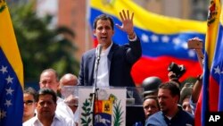 Juan Guaido, head of Venezuela's opposition-run congress, declared himself interim president until new elections can be called in Caracas, Venezuela, Wednesday, Jan. 23, 2019. (AP Photo/Fernando Llano)