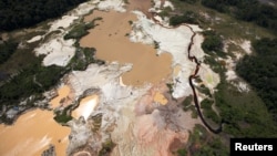 An aerial view of the environmental damage caused by illegal mining at the Canaima National Park in southern Bolivar State on June 17, 2010. 