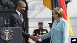 President Barack Obama shakes hands with German Chancellor Angela Merkel on the South Lawn at the White House in Washington, June 7, 2011.