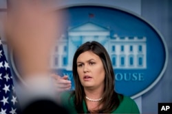 White House press secretary Sarah Sanders calls on a member of the media during the daily press briefing at the White House, Aug. 15, 2018. Sanders announced that President Donald Trump will remove the security clearance from former Obama administration CIA director John Brennan, a vocal critic of the president, and the administration will be reviewing the security clearances for a number of other former officials.