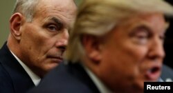Homeland Security Secretary John Kelly listens to U.S. President Donald Trump during a meeting with cyber security experts in the Roosevelt Room of the White House, Jan. 31, 2017.